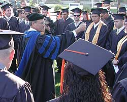 Dr. Fareed Nader perepares graduates for the ceremony.